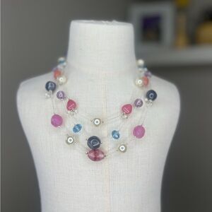 Faux pearl and stone floating silver tone necklace in pinks purples and blues